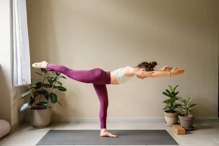 Achieving the Perfect Tone: How Often Should You Exercise for Results? 1 Woman doing Yoga exercise Frimley to help with toning the body.