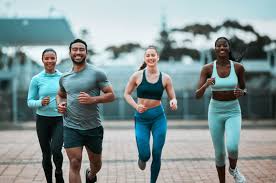 Sculpting Sleek Arms: The Essential Role of Cardio in Toning Without Bulking Up 3 image of people running to incorporate cardio Frimley exercise into their life to help tone arms and body.