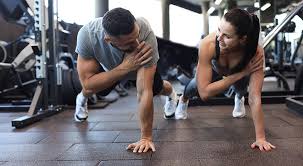 Sculpting Sleek Arms: The Essential Role of Cardio in Toning Without Bulking Up 1 Image of man and woman doing Cardio Frimley to tone their arms.